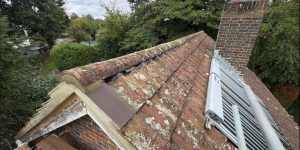 Completed roof ridge with re-bedded tiles and dry ridge system, Forest Row